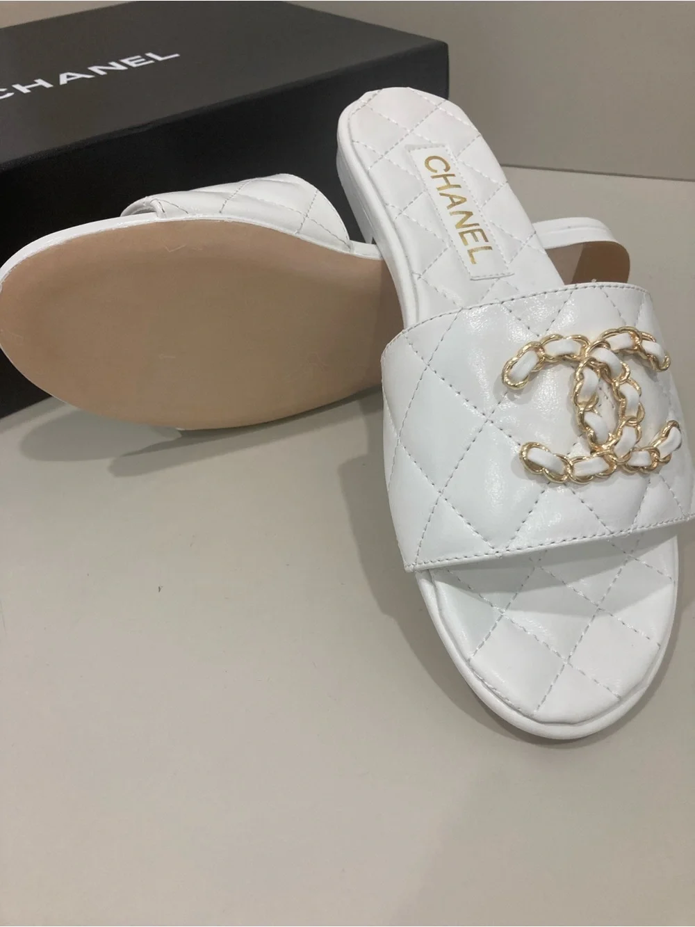 CHANEL White Quilted Slide Mules with Gold CC Chain Logo